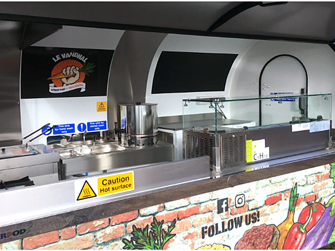 Le Vandhal Caterpod kitchen with brick-print wrap